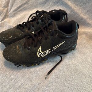 Nike Black and White Cleats with Sleek Design